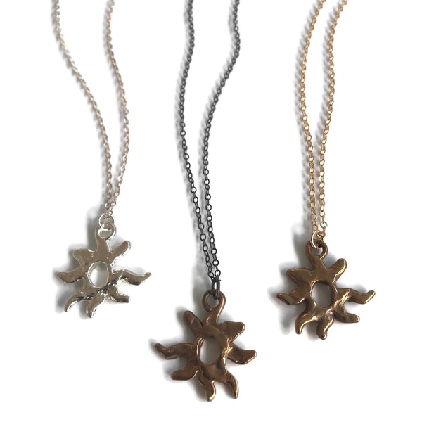 hand-sculpted small sun pendant necklaces in silver, bronze/oxidized, bronze/gold-filled