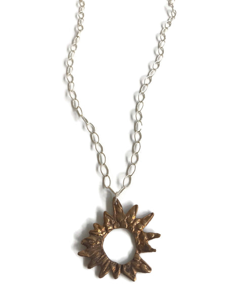 bronze hand-sculpted sunburst pendant on sterling silver large open cable chain