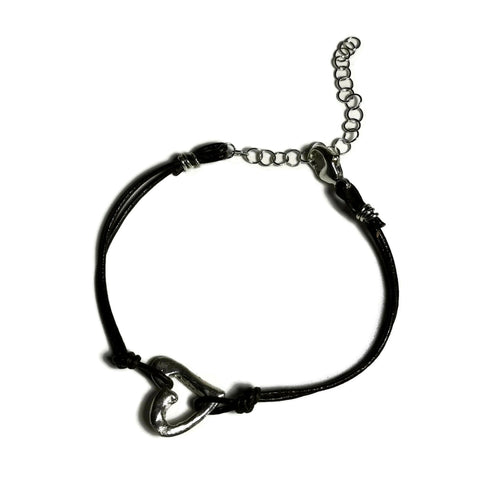 hand-sculpted small open heart charm on skinny dark brown leather bracelet