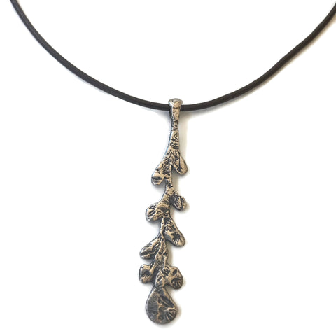 hand sculpted long silver leaf on black leather necklace
