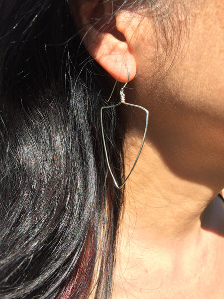 big triangle earrings on pretty model