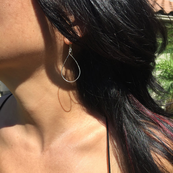 sterling silver teardrop earrings on pretty model